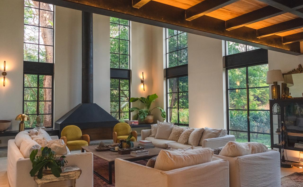 Living room with fireplace and jungle views